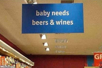 Sign: "Baby needs beer & wines"